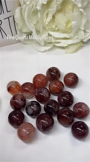 TrueNorthCrystal 🇨🇦 on Instagram: "Fire Quartz Mini Spheres: Ignite Your Energy in Every Sparkling Sphere ❤️Join our Live on Friday Dec 19th at 7pm EST. Fire Quartz, also known as Hematoid Quartz, is a striking crystal that combines the clarity-enhancing power of clear quartz with the grounding energy of hematite. Its fiery red, orange, and rust-colored inclusions create a flame-like effect, symbolizing passion and transformation. This stone is prized for its ability to boost confidence, sharp