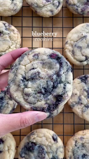 blueberry cookies!! these blueberry cookies are so soft, chewy and filled with fresh blueberries!! i made some homemade blueberry jam using fresh blueberries to swirl into the cookie dough, which looks so pretty!! it is super delicious and bursting with flavour 🫐🍪 ig - bakewithcel recipe by juliemarieeats #baking #baketok #blueberry #blueberries #cookies #blueberrycookies #blueberryjam