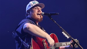 Luke Combs bizarrely makes losers of his fantasy football league sing in front of thousands of people on stage