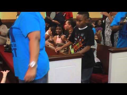 Little boy shouts during praise break at Solid Rock Community Church.