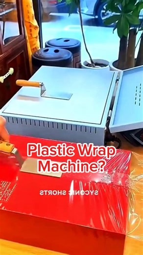 Ever wondered how they wrap those boxes so perfectly? This machine heats, stretches, and tightly seals the plastic in seconds — making it smooth and flawless every time! 🔥✨ Would you try this at home or in your shop? 🧐 #SatisfyingVideo #MadeInChina #PackagingMachine #Outoftime #ViralShorts #DIYTools #FactoryLife | Out Oftime