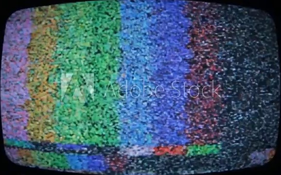 Static screen from a vintage television with a dark frame, showing grainy noise