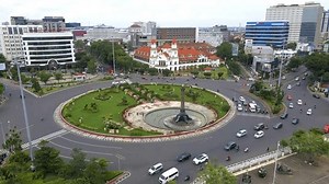 Semarang, Central Java, Indonesia - March 2 2024: Traffic atmosphere around the Tugu Muda Semarang area during the day, you can see a very beautiful view of Tugu and Lawangsewu