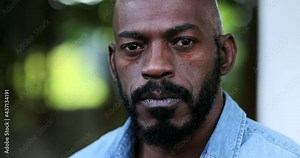 Confident black man portrait face close-up. African person