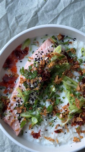 Natalia Rudin on Instagram: "A brothy rice situation makes me very happy, especially when it’s cold and wet outdoors!! This is a coconuty broth, fragranced with lemongrass and ginger and it works perfectly as poaching liquid for some fish - I’ve used salmon but you can use whatever! Ingredients: 1 tin of coconut milk 1 lemongrass stalk large knob of ginger 1 red thai chilli 2 cloves of garlic 1 sprig of spring onion 2 salmon fillets To serve: 200g cooked rice 1 spring onion, sliced chilli oil to