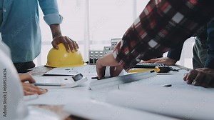 Architectural engineer team meeting Use of blueprints, construction drawings and calculations for architectural projects and engineering tools in the workplace technical structure concept.