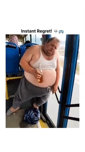 GreatClipsHub 1 on Instagram: "The video features a startling 10-second clip that captures a dangerous moment on public transit—and the sudden outcome is nothing like what people expect. ‎ ‎The footage shows an intoxicated man leaning heavily against the rear door of a moving bus while holding a bottle. As the bus rounds a curve, the pressure of his weight causes the door to malfunction and swing wide open, sending him tumbling out onto the asphalt of a busy highway. This terrifying moment serve