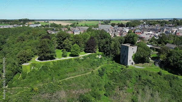 city of beaumont in belgium circling aerial drone shot revealing tour salamandre remains of medieval keep tower city walls