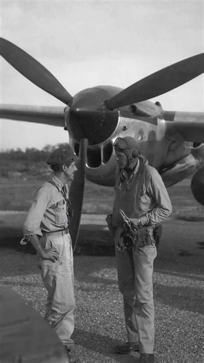 USAAF ace Major Thomas McGuire and famed aviator Charles Lindbergh share a moment after returning from a mission at Biak Island, Dutch East Indies, July 1944. Behind them stands a P-38 Lightning—possibly McGuire’s own. Lindbergh, though a civilian advisor, flew over 50 combat missions and helped teach pilots how to extend the Lightning’s range by nearly 50% through fuel-saving techniques. #ww2 #aviation #aircraft #pilot | World War II Aircraft