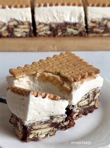 Frozen mocha biscuit bars by @noa.tasty 12 bars | 20 minutes active Base & top: • 24 petit beurre-style biscuits or graham crackers • 1 cup brewed coffee, cooled Coffee layer: • 7 ounces/200 grams milk chocolate, finely chopped • 3.5 ounces/100 grams unsalted butter, cubed • 1 teaspoon instant espresso powder • 2 tablespoons granulated sugar • 1 cup/240 grams heavy cream, heated • 10.5 ounces/300 grams petit beurre biscuits or graham crackers, coarsely crushed • 2 tablespoons unsweetened cocoa p