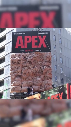 Charlize Theron Climbs the Walls of Times Square to Promote New Movie 'Apex'
