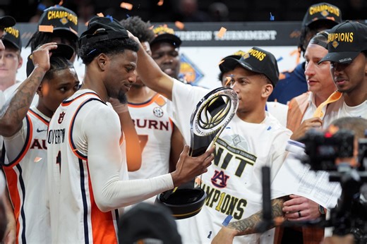 Auburn celebrates after winning the NIT