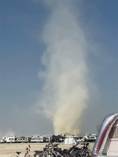 Giant Dust Devil Swirls Through Desert Camp