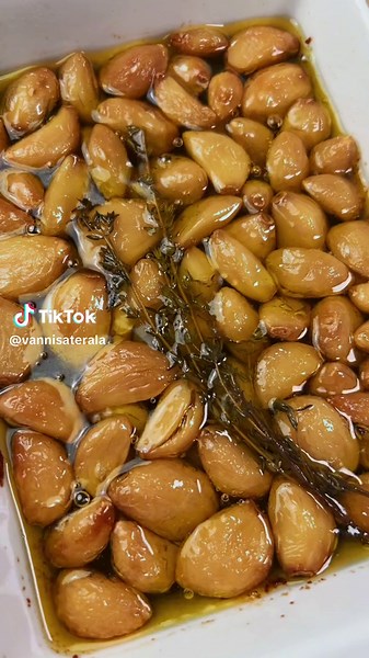 Part 153. Garlic Confit. This can go on many recipes to add depth. Ingredients 1.5 cups peeled garlic 2 cups olive oil 2 sprigs of thyme Directions 1. preheat the oven to 250F. 2. Put the garlic in an oven safe vessel and pour the olive oil over. It should cover all the garlic. 3. You’ll need to cook this low and slow to avoid burning for 2 hours. 4. Let it cool and store in the fridge. #garlic #easyrecipe #recipe #baking #bakingrecipe