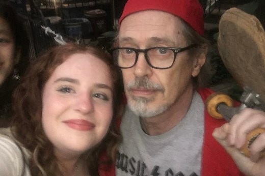 Steve Buscemi, dressed as his own meme, hands out candy in Park Slope