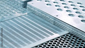 Lattice plates for production needs. Grid metal sheets after stamping process