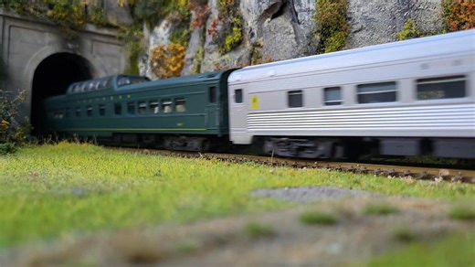 Southern Railway's "Crescent Limited" glides between the tunnels near the Romig Coal Yard. | Suncoast Model Railroad Club