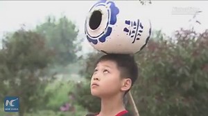 24K views · 118 shares | Juggling hats, doing handstands and supporting a basketball with a wooden stick in mouth. 1,500 students perform amazing acrobatic stunts along an ancient canal in Wuqiao, a county known as the "cradle of Chinese #acrobatics." | China Xinhua News | Facebook