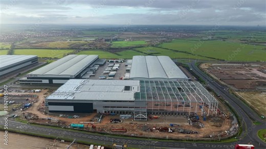Northampton, United Kingdom - 17 January 2026: Aerial view of the Royal Mail Midlands Super Hub, showing the distribution center and surrounding green fields.