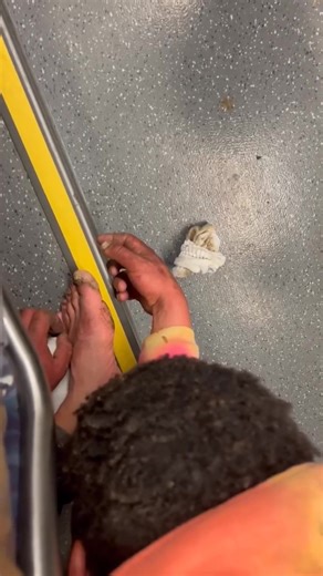 "I really really really didn't want him touching me." A reader sent this video he took showing the head and assorted body parts of a rider who was halfway in and out of the seat behind him on a Sound Transit light rail car as it approached Westlake station in downtown Seattle yesterday. As you can see, the guy is filthy and missing at least one shoe. He's apparently under the influence of some drug as well. "He was bent over so far that he was basically under my seat," the reader said. "It was s