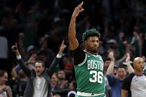 Why does Marcus Smart dye his hair green?