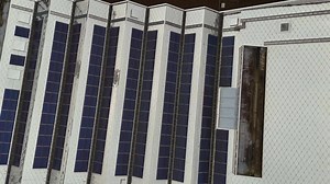 Modern rooftop with solar panels and detailed building structure view