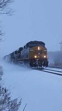 CSX M368 flies through t he snow storm with interesting cars in its train! 123125 #storm #trains