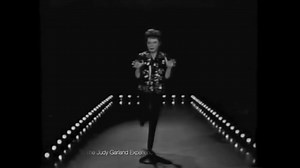 Take a break for a minute and sit back and watch/listen to Judy Garland sing a chorus of one of her most popular songs. | The Judy Garland Experience