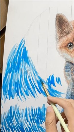 Using #coliro metallic watercolors to #paint the waves around the fox
