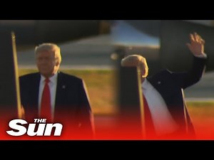 President Trump appears to SLIP as he walks on stage at New Hampshire rally