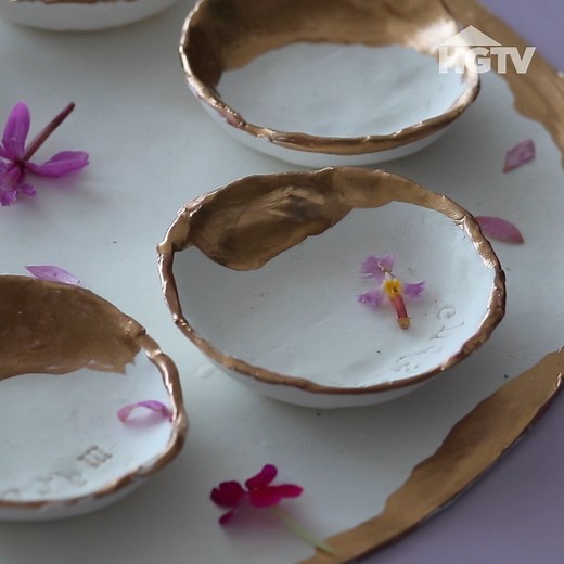 It's not a Passover Seder without a Seder plate! 🤗 Make your own elevated version with oven-bake clay and gold gilding paint. Follow our DIY polymer clay seder plate instructions >> http://hg.tv/3tkRsGf 🍖 ⚠️ Note: Though the ritual items placed on top of a Seder plate are not intended to be eaten, it’s still important to note that this plate is not food-safe. Do not consume any items you place on top of it. ⚠️ | HGTV