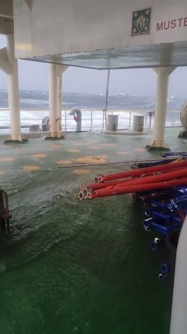Rough waves flood ship deck during North Atlantic storms