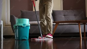 Woman Cleaner Mopping Living Room Floor