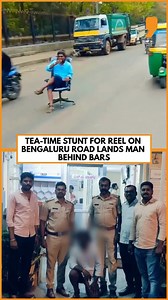 A Bengaluru man was arrested after a video of his dangerous stunt on a busy road went viral on Instagram. In the clip, he’s seen casually sitting on an office chair in the middle of a public road, sipping tea as autorickshaws and two-wheelers pass dangerously close. The Bengaluru police took to X (formerly Twitter) and wrote, “Taking tea time to the traffic line will brew you a hefty fine, not fame !!! BEWARE BCP is watching you”. . . . . . #bengaluru #bengaluru_diaries #bangalore #bangalorepoli