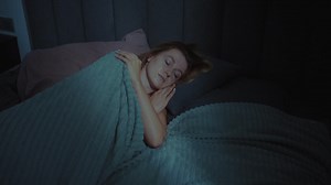Woman Sleeping in Bed at Night | Premium Stock Video Footage