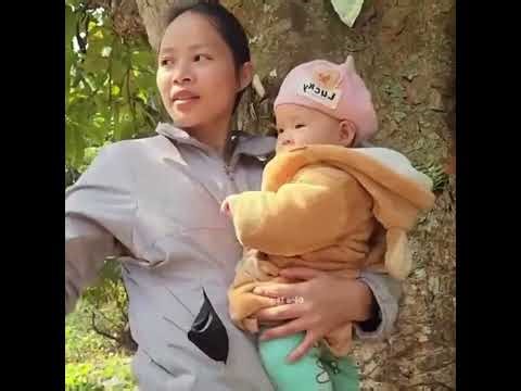 Single Mom with Her Baby Making a Leaf House to Keep Her Baby Safe