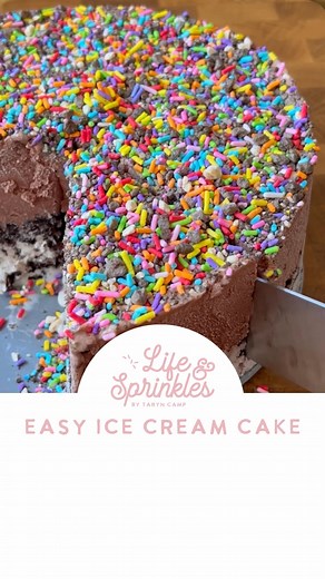 Easy Ice Cream Cake! In a springform pan, add a piece of acetate paper around the inside. Choose two flavors of ice cream and let them both side out and get melty, not melted. Add the first flavor to the bottom of the pan and smooth it out (however much you like). Top it with crushed cookies- I used regular Oreos. Be sure to press the into the ice cream. Add the next flavor of ice cream to the pan and smooth it out and top it with sprinkles. Press that into the ice cream as well. Let it sit in t
