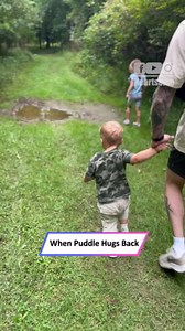 Little boy slips and falls into puddle