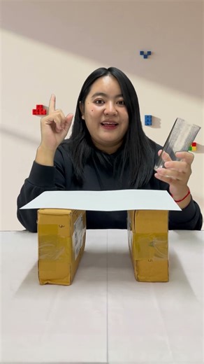 How can I make a piece of paper support the weight of a cup of water?