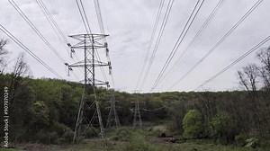 passing underneath powerlines transformer pylon (electricity, electric current supply rural line) moving below under power lines