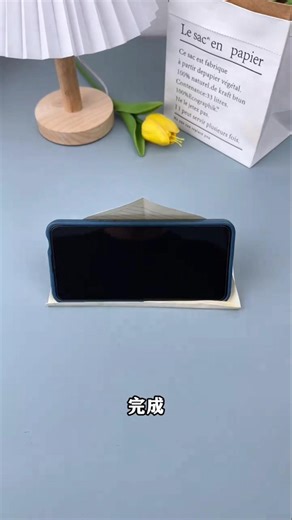 DIY paper phone stand using just one sheet.