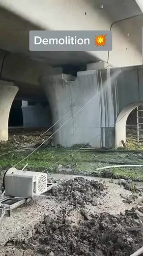 Bridge Demolition Process Underway with Heavy Machinery