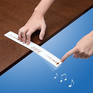 A Specially-Marked Ruler That You Flick Off the Edge of a Hard Surface to Play Musical Notes