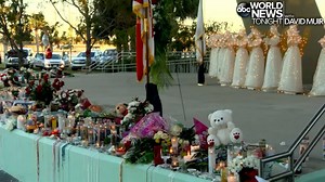 STONEMAN MEMORIAL: Candles and crosses covered a makeshift memorial at Marjory Stoneman High School in Florida in honor of the 17 victims who died at a shooting there on Valentine's Day. http://abcn.ws/2GdFDZN | ABC World News Tonight with David Muir