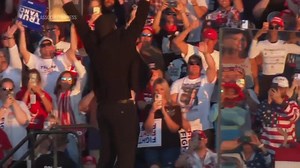 Elon Musk jumps around on stage as he joins Trump at rally