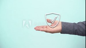 hand holding protect shield with a check mark icon on blue background. Protection network security computer and safe your data concept .