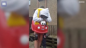 Woman gets stuck in a toy car and has to be cut free with a knife