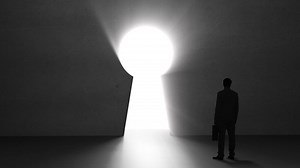 Businessman looking at giant keyhole Premium Stock Video Footage