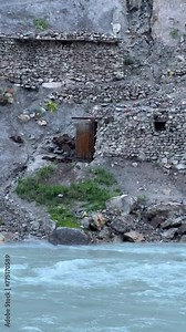 Old villages in Tajikistan. Tajikistan's road along the Zeravshan River near the Pamir highway. Old stone villages in the mountains of the Silk Road. 4К