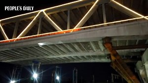 A two-level pre-built highway bridge structure weighing 29,000 tonnes was successfully rotated into position on Thursday, spanning over the Guangzhou–Shenzhen railway in S China. | Modern China